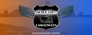 Motor City Candleworks shield on red/blue background of Detroit skyline